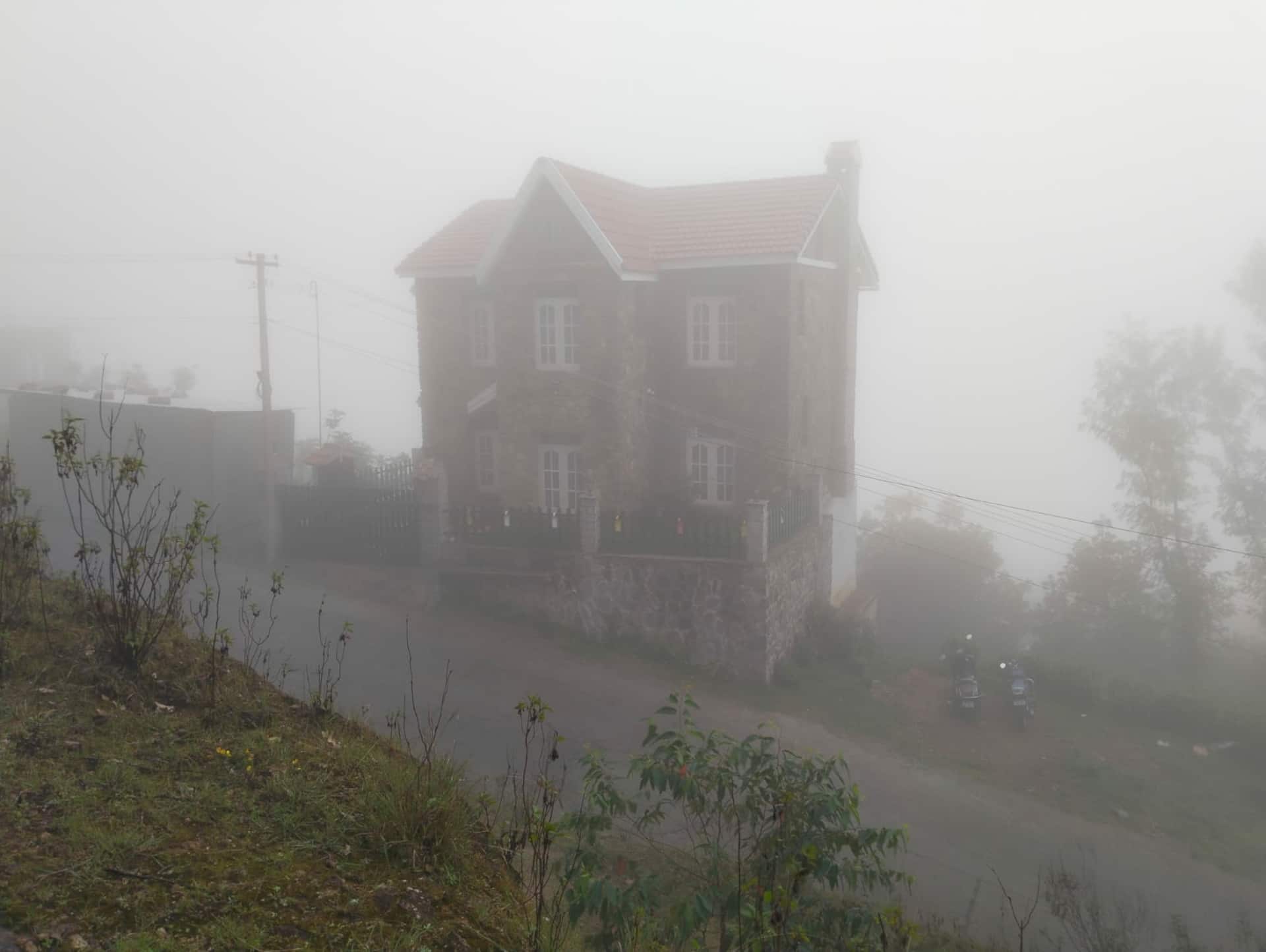 A stone house, wrapped in mist