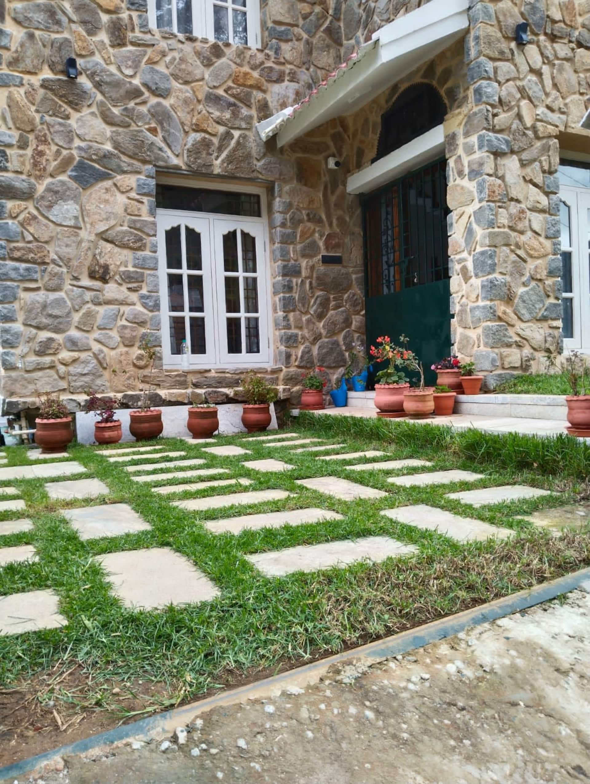 Stone garden wall and terraced lawn